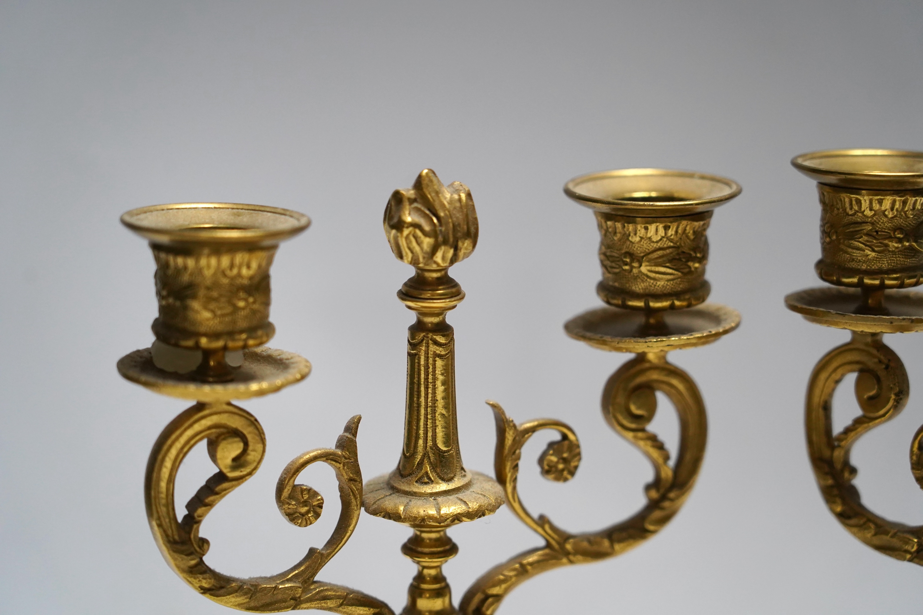 A pair of late 19th century alabaster and gilt metal two light candelabra, 22cm. Condition - good
